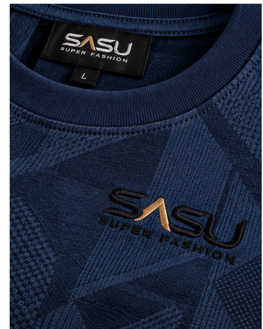 Close-up of the embroidered logo, ribbed collar and geometric knit pattern on the navy T-shirt