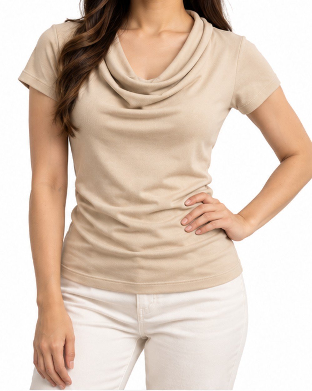 Woman wearing the beige cowl neck top with white jeans, hand on hip