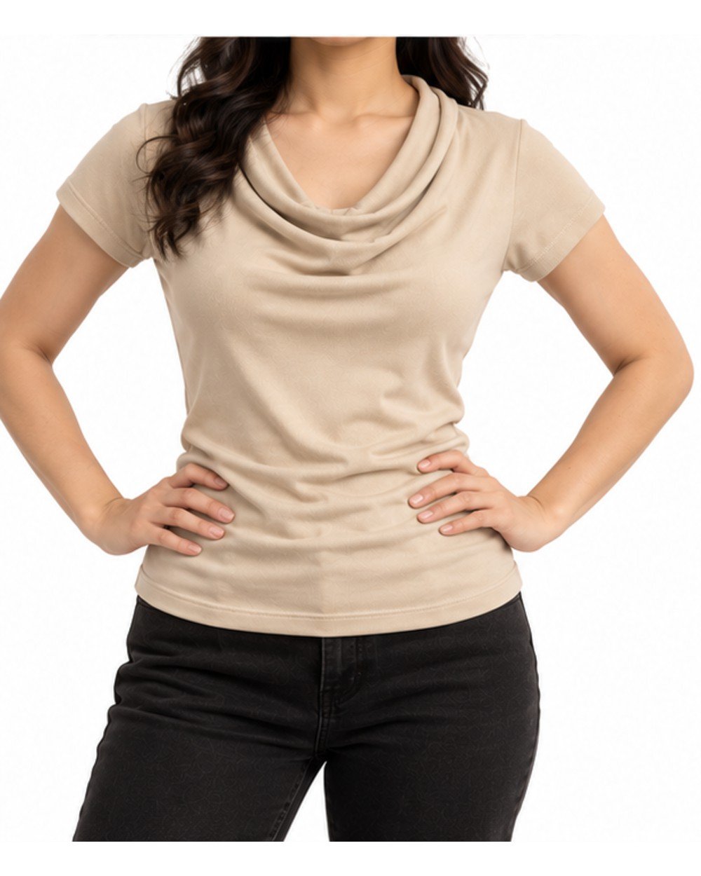 Woman wearing the beige cowl neck top with black jeans, hands on hips