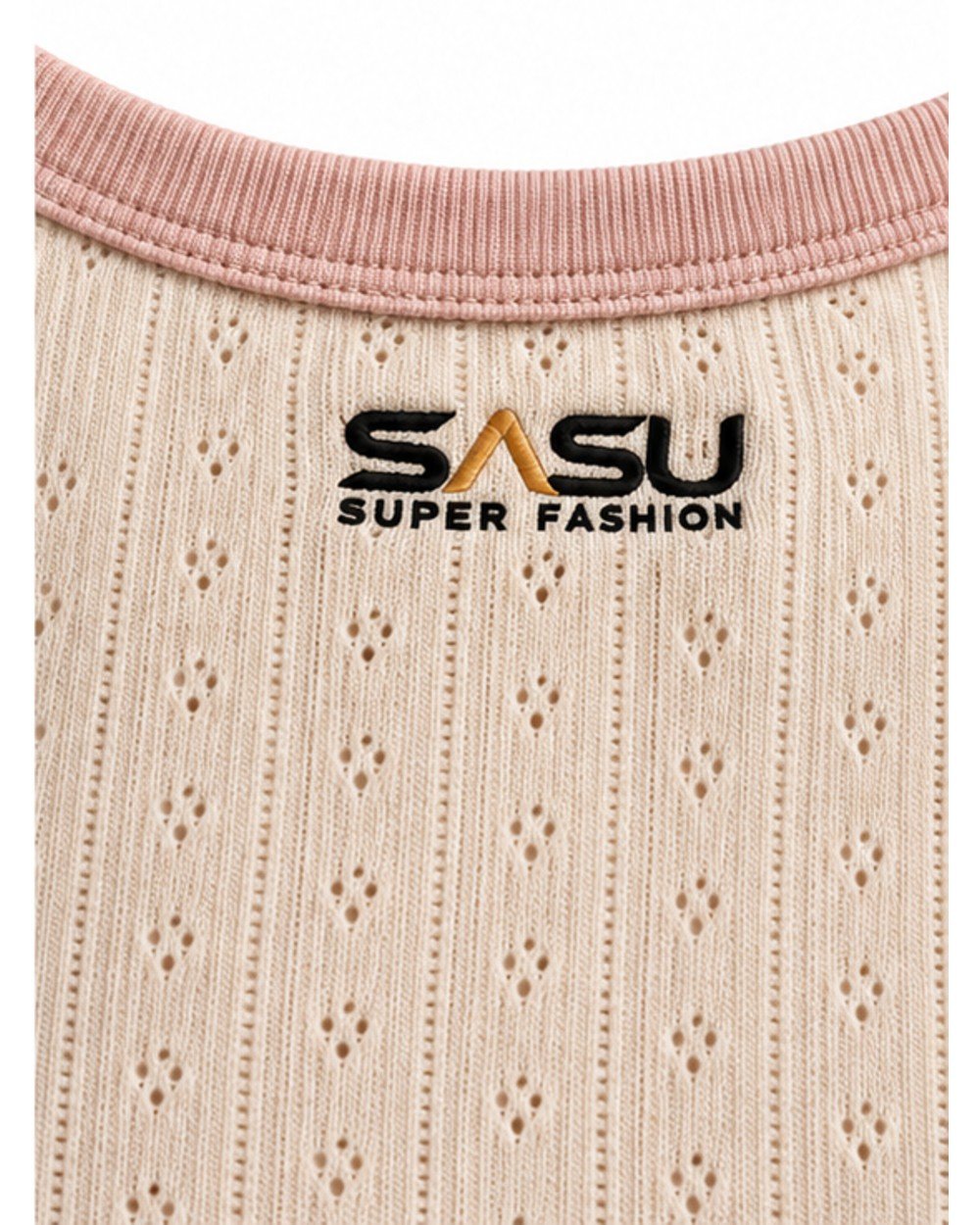 Close-up of the pointelle eyelets, pink ribbed neckline and embroidered logo